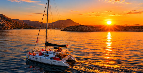 Kolympia: Catamaran Sunset Cruise with Unlimited Drinks