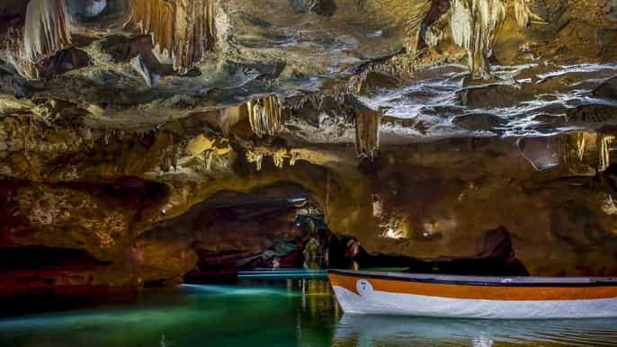 From Valencia: Boat ride through the impressive Caves of Sant Josep.