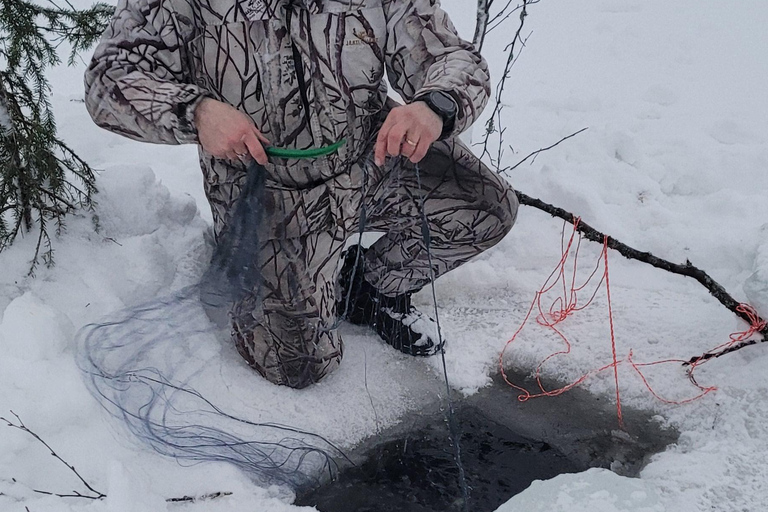 Rovaniemi: Ice Fishing, Snowmobile, and Net Fishing Tour