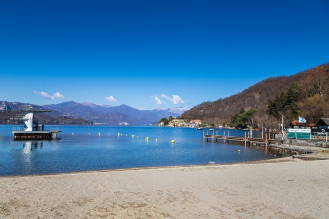 Visit Orta Lake Boat tour and Relax on the beach in Scopello, Italy
