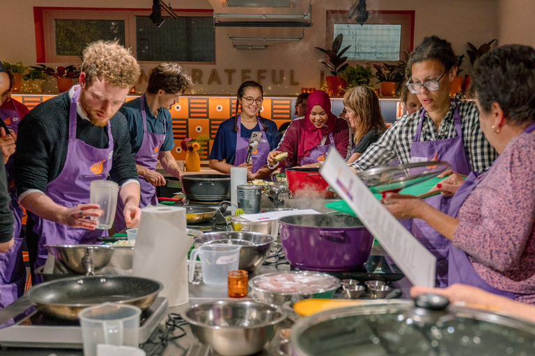 Bristol: Cook Authentic Family Recipes with a Refugee Chef Cooking class with drinks, nibbles, and apron souvenir
