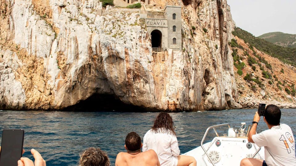 From Cala Domestica: Sunset boat tour to Porto Flavia | GetYourGuide