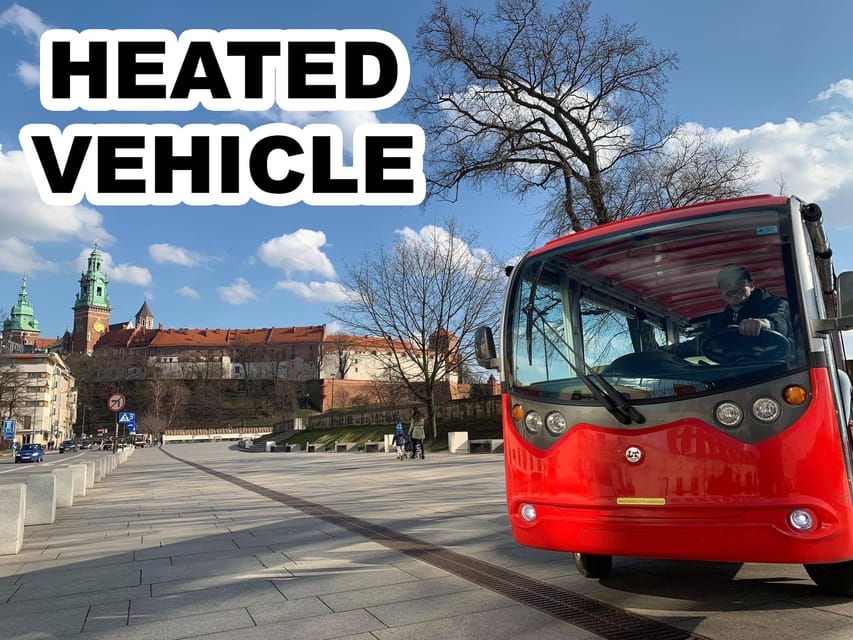 A red electric sightseeing buggy with its driver at the wheel stands on a paved square below Wawel Castle; a caption reads Heated vehicle