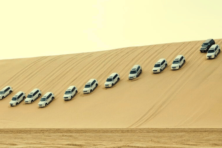 Qatar : Safari dans le désert au coucher du soleil avec promenade à dos de chameau et planche à sable.Visite privée