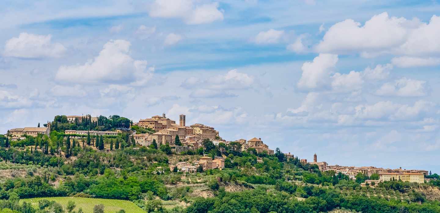 Von Rom aus: Geführter Tagesausflug in die Toskana mit Mittagessen und Weinverkostung
