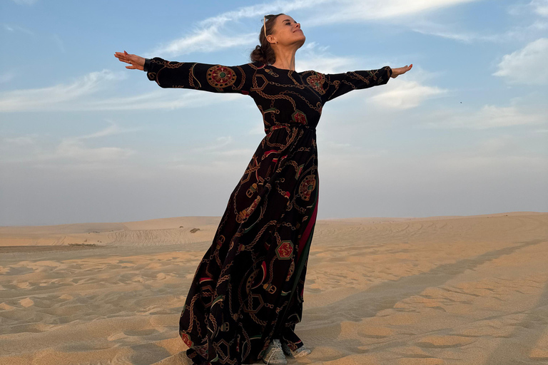 Doha: Arabic Costume, Desert Safari, Sandboarding & More Group Tour with Camel Ride in traditional Arabic Costume