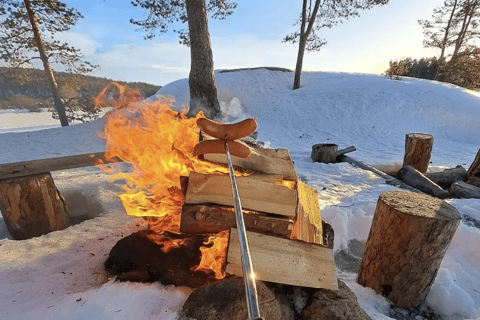 From Saariselkä: Ice Fishing Tour with Open Fire Cooking