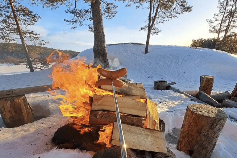 From Saariselkä: Ice Fishing Tour with Open Fire Cooking
