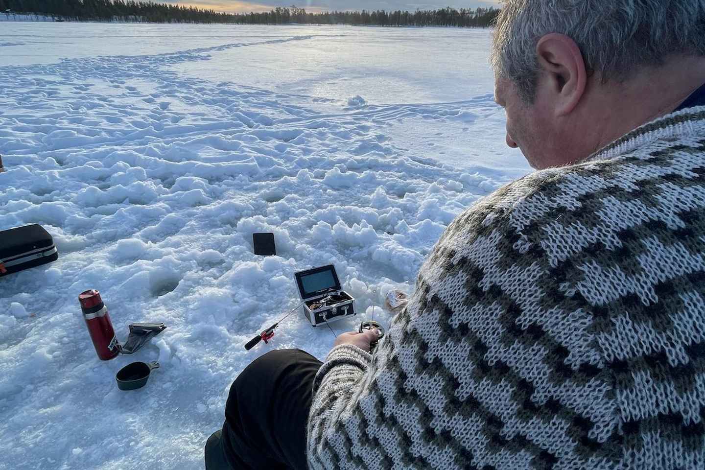 Sälen: Ice Fishing Experience cooking you catch