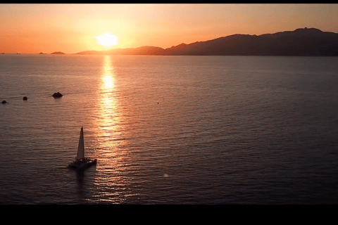 Sunset to Corsican song on a catamaran