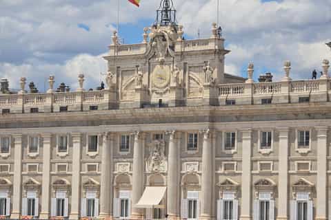 Small guided group visiting the exterior of Royal Palace Madrid