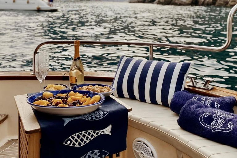 Capri Boat Tour with Caves, Swimming, Aperitif and Champagne From Capri: PRIVATE Capri Boat Tour