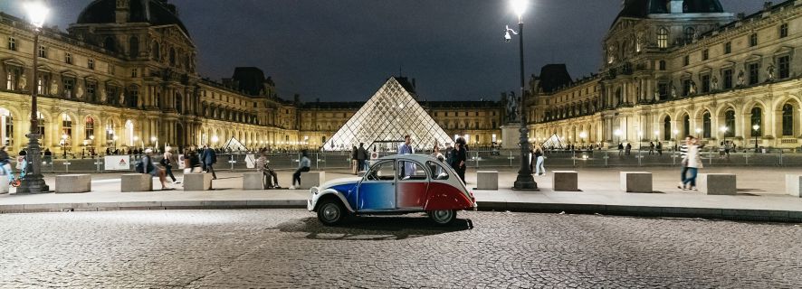 Discover Paris by Night in a Vintage Car with a Local