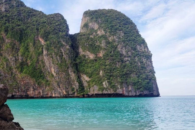 Phi Phi: 7 Islands longtail boat with Sunset and Plankton