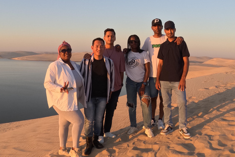 Qatar : Safari dans le désert au coucher du soleil avec promenade à dos de chameau et planche à sable.Visite privée