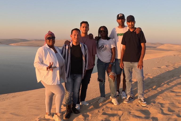 Qatar : Safari dans le désert au coucher du soleil avec promenade à dos de chameau et planche à sable.Visite privée