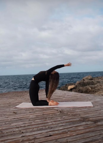 Visit Vinyasa Yoga Class at the beach Sa Rapita in Santanyí, Spain