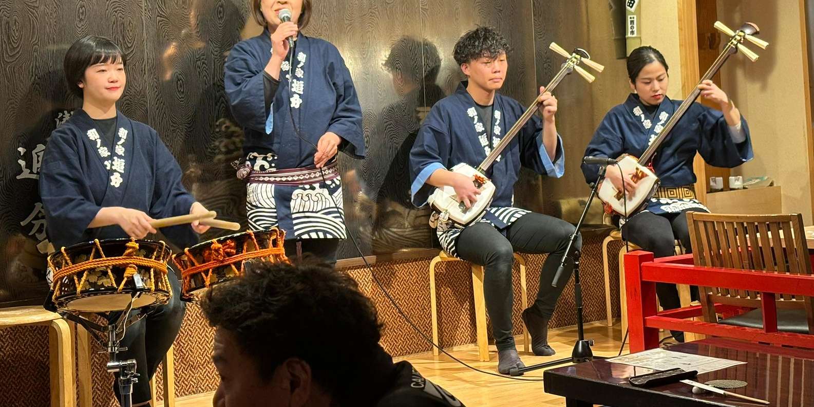 Tsugaru shamisen performance over traditional dinner | GetYourGuide