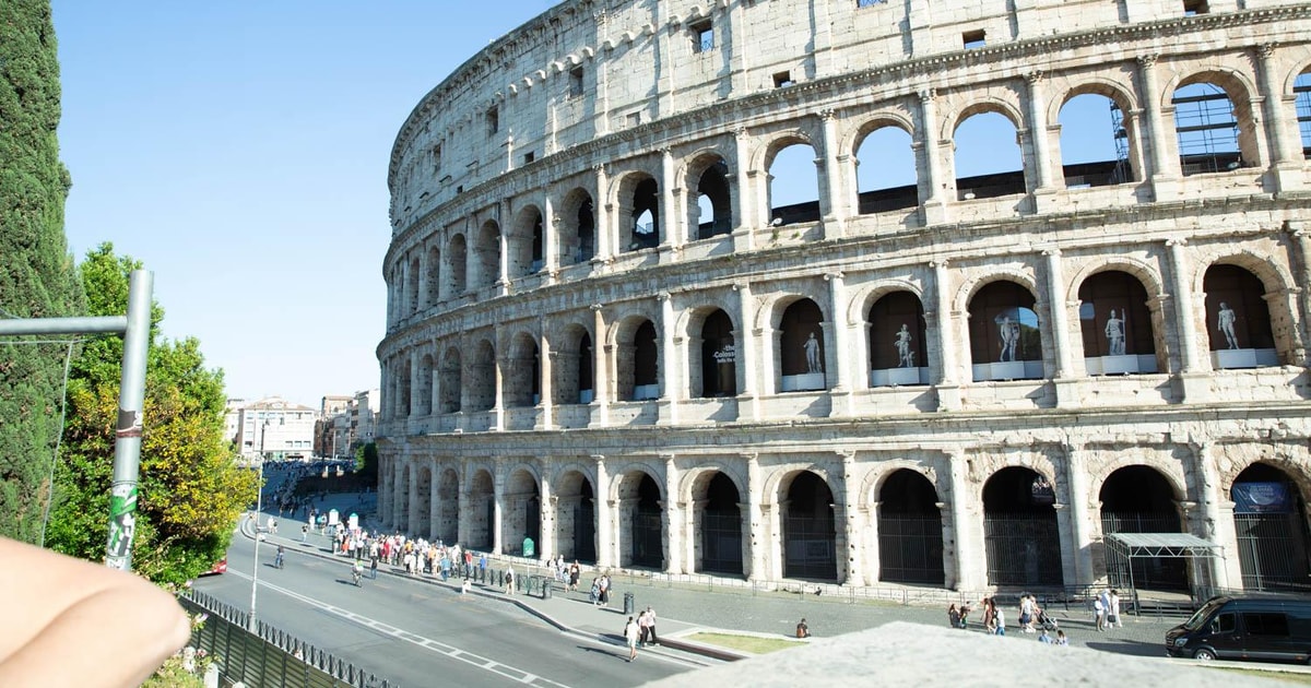Colosseum Gladiators Gate with Roman Forum & Caesar's Palace | GetYourGuide