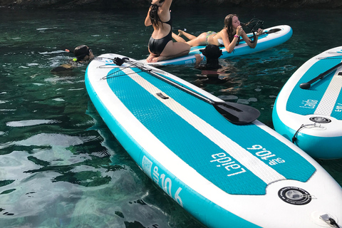 Paddelsurf i solnedgången, grottor, snorkling och cava