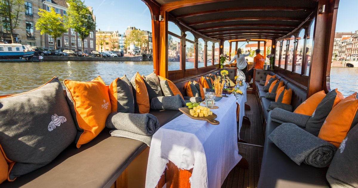 Amsterdam: Classic Saloon Boat Cruise with Cheese & Wine | GetYourGuide