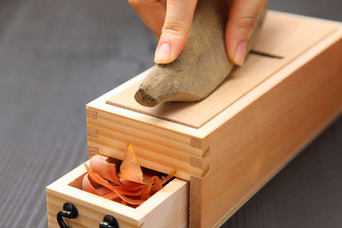 Nigiri-zushi making and soy sauce squeezing sushi