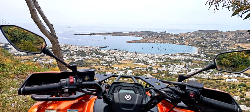 Whitewashed houses and a marble-paved lane climbing through an inland Paros village