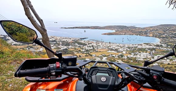 Whitewashed houses and a marble-paved lane climbing through an inland Paros village
