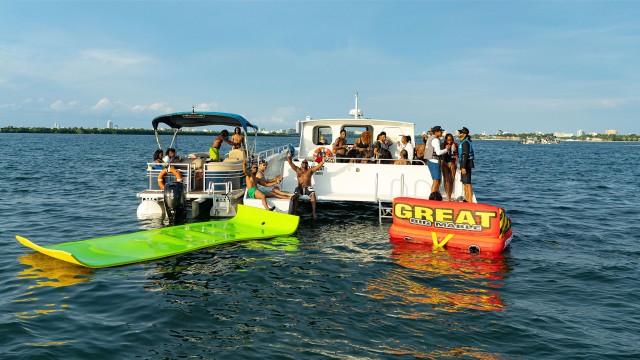 Visit Miami Day Boat Party with Jet Ski, Drinks, Music and Tubing in Miami Beach