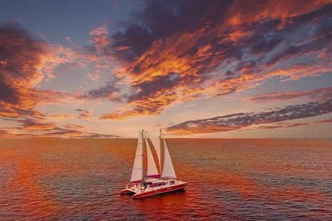 Oranjesta: Sunset Cruise to Boca Catalina with BBQ Dinner