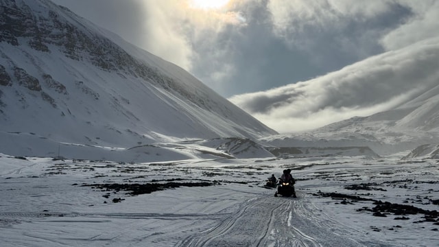 Svalbard: Exploring Ice Cave Adventure by Snowmobile
