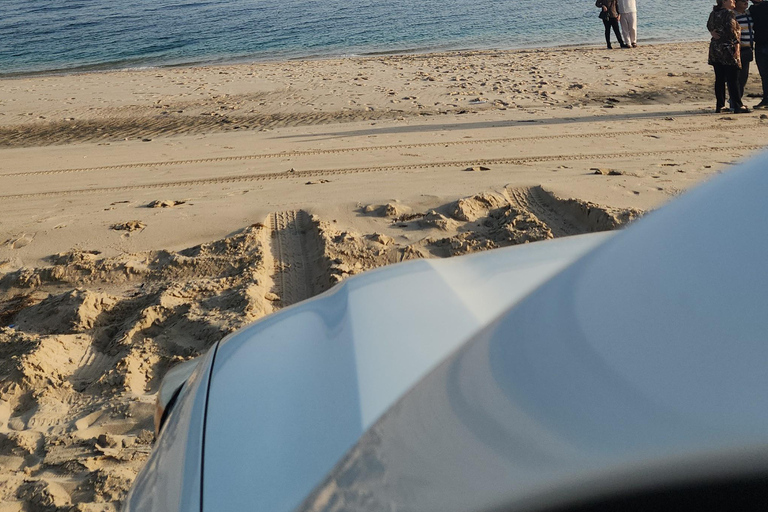 Doha: inland sea Tour With Dune Bashing &Sandboarding fun Doha: safari , camel ride, sandboarding hotel pickup