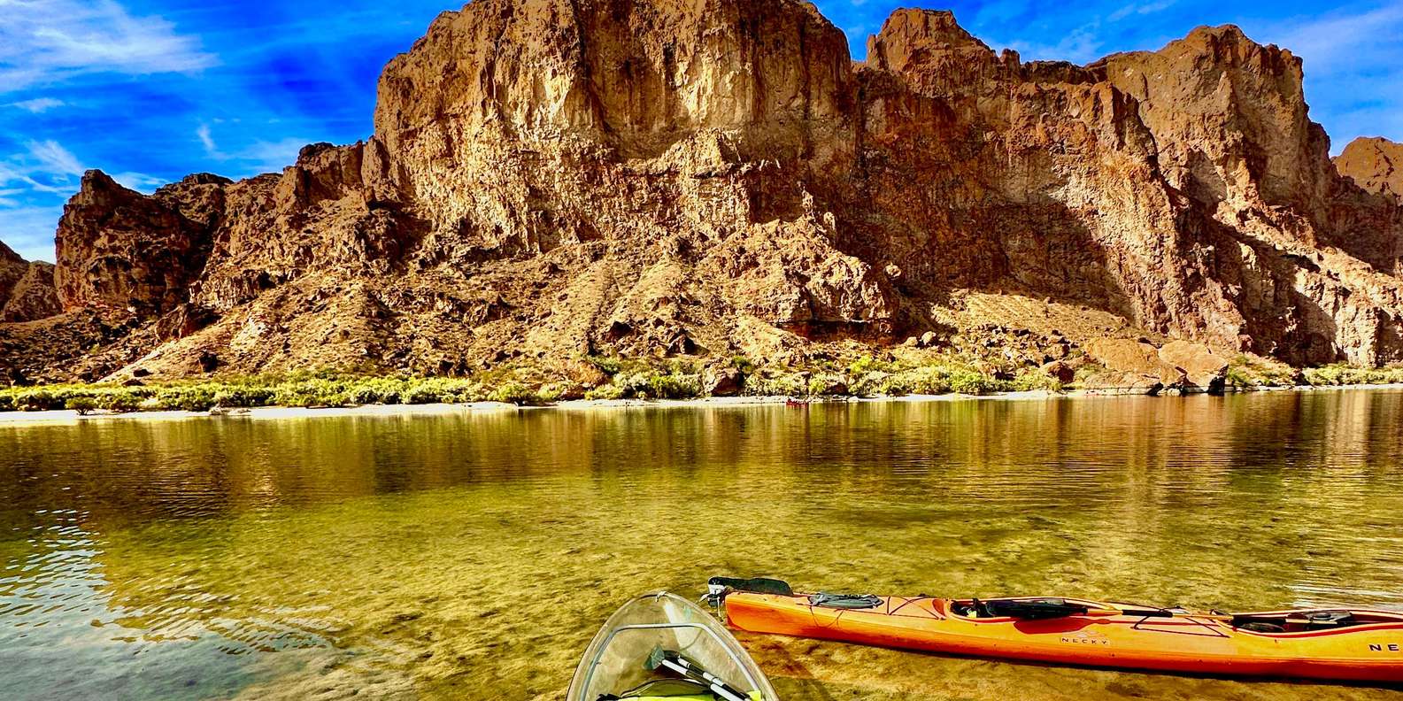 Group of kayakers approaching Emerald Cave from Willow Beach