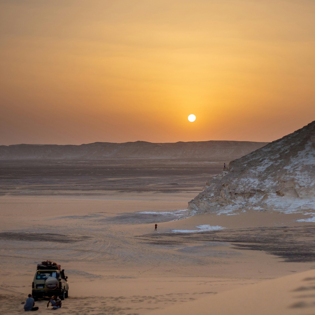 Four-wheel-drive vehicle at sunset in Siwa desert