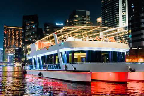 Dubai sunset or dinner cruise with live music and open bar